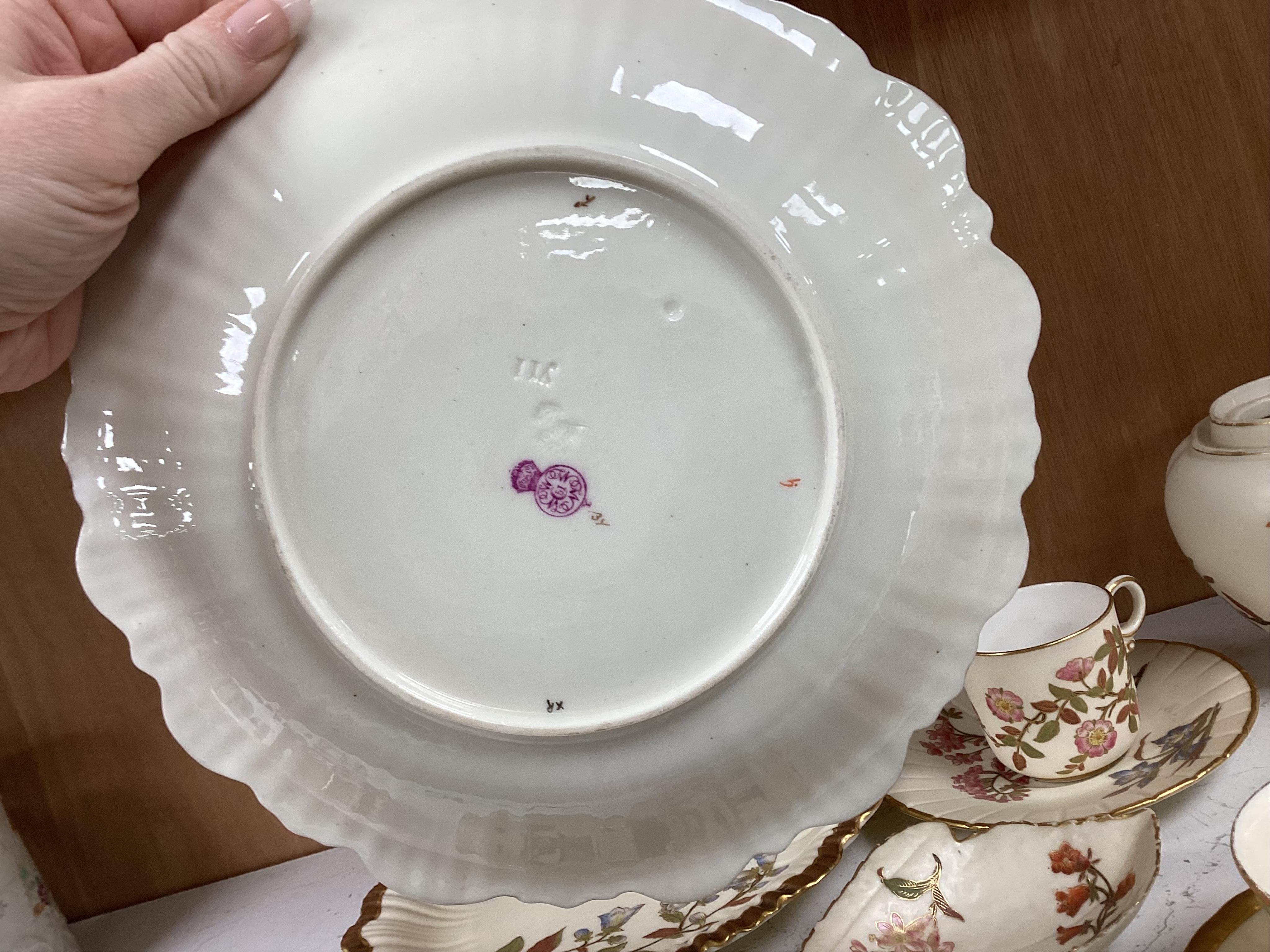 A collection of 19th century Worcester blush ivory to include a pair of gilt plates, various cups and saucers and a jar